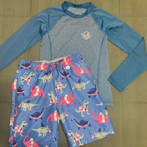 Boys blue rash guard and dinosaur swim trunks set